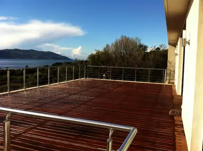 a large deck with a view of the water at Casaluce in Casaglione