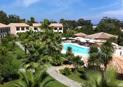 an aerial view of a resort with a pool and palm trees at Vacancéole - Résidence Sognu di Mare in Linguizzetta