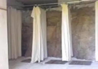 two white curtains are hanging in a room at Auberge de Jeunesse Chez Mc Donald in Zevaco