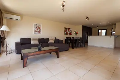 a living room with a couch and a table at Sci Albellu in Sagone