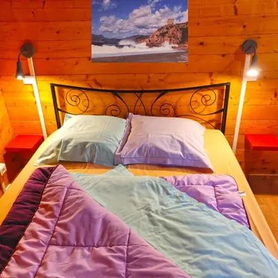 a bed with two pillows on it in a room at Funtana a l'Ora in Porto Ota