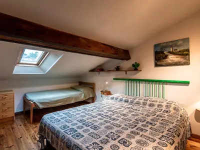 a bedroom with a bed and a window at Apartment Villa Volpajola by Interhome in Cervione