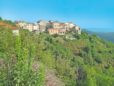 a group of houses on top of a hill at Apartment Villa Volpajola by Interhome in Cervione