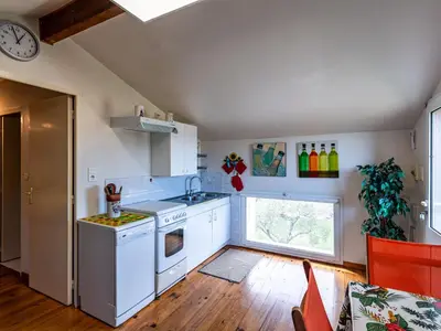 a kitchen with white appliances and a window at Apartment Villa Volpajola by Interhome in Cervione