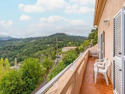 a patio with a table and chairs and a view at Holiday Home Filippi by Interhome in San-Giovanni-di-Moriani