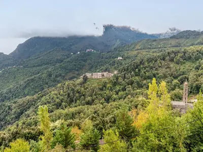 a balcony with a view of the mountains at Holiday Home Filippi by Interhome in San-Giovanni-di-Moriani