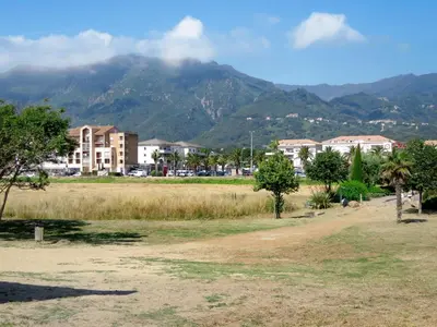 a view of a city with a mountain in the background at Holiday Home La Cerisaie by Interhome in Santa-Lucia-di-Moriani