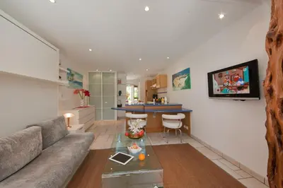 a living room with a couch and a table at Studio Cartarana in Bonifacio