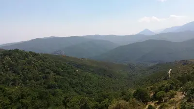 an aerial view of a mountain valley with mountains at Rinasce In Corsica in Poggio-di-Venaco