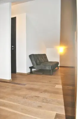 a couch sitting in the middle of a room at Maison chaleureuse à Bonifacio, 90 m², piscine partagée in Conte