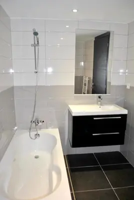 a white bathroom with a sink and a shower at Maison chaleureuse à Bonifacio, 90 m², piscine partagée in Conte