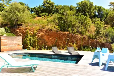 a pool with two chairs and two laptops on it at COLOMBA in Conca