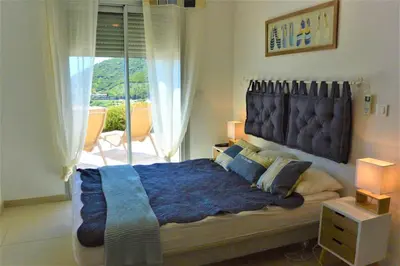 a bedroom with a large bed with a large window at COLOMBA in Conca