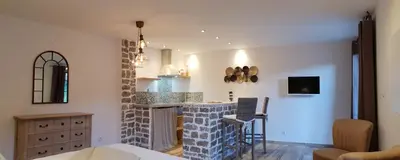 a kitchen with a brick fireplace in a room at Maredda 2 in Sartène