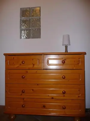a dresser with a lamp on top of it at Vue mer panoramique plage 50m Porticcio Corse in Porticcio