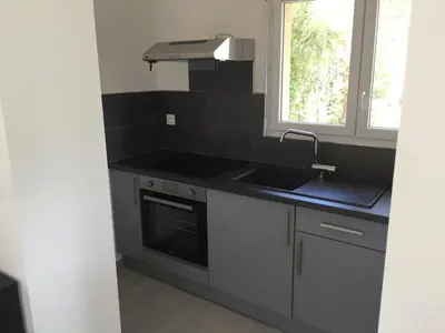 a kitchen with a sink and a window at A Casetta di Rosa in Corte