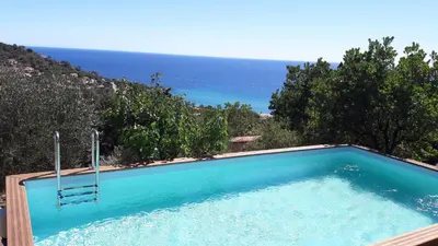 a swimming pool with a view of the ocean at Domise in Conca