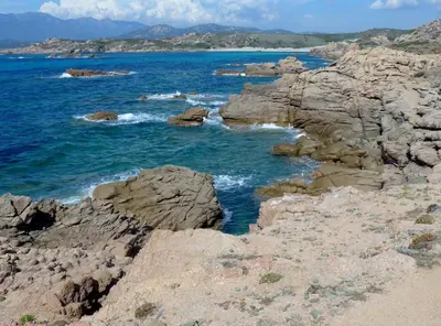 a view of the ocean from a rocky beach at Luna verde in Porto-Vecchio