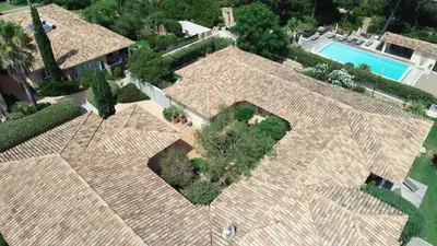an overhead view of a large house with a swimming pool at Résidence Marina Rossa in Porto-Vecchio