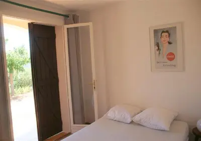 a bedroom with a bed with two pillows on it at Maja in Favone