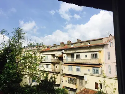 a view of a building from a window at Hôtel U Passa Tempu in Corte