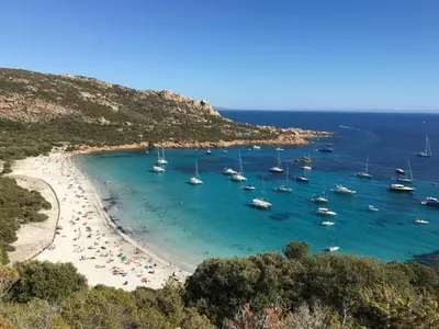 a group of boats in the water on a beach at Sweet Holiday in Porto-Vecchio
