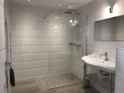 a bathroom with a shower and a sink at Sweet Holiday in Porto-Vecchio