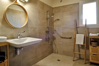 a bathroom with a sink and a mirror at Villas Abbartello in Olmeto