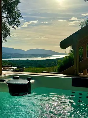 a swimming pool with a view of the water at BERGERIE A Murta, Domaine de l Ogliastru in Olmeto