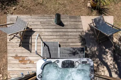 an aerial view of a grill and two chairs at Cabane Dans les Arbres, Domaine de l Ogliastru in Olmeto