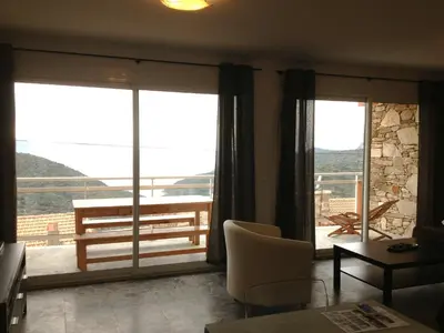 a living room with a view of a balcony at Casa Suprana in Partinello