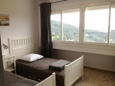 a small bedroom with a bed and a window at Casa Suprana in Partinello