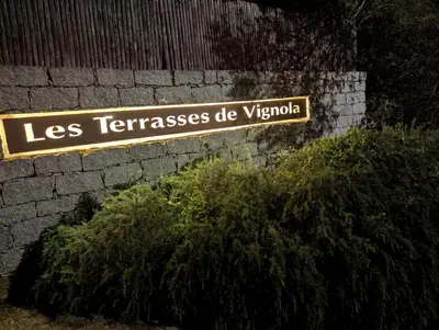 a sign for las terraciones do yucacio at Les Terrasses De Vignola in Porto-Vecchio