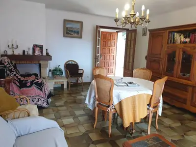 a living room with a table and chairs and a couch at Beau F4 petreto-Bicchisano in Petreto-Bicchisano
