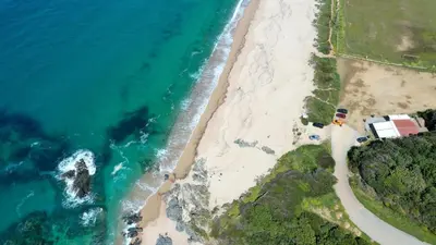 an aerial view of the beach and the ocean at Vigna Maggiore in Olmeto