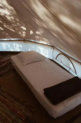 a bed in a tent in a room at Village Del Mar in Solaro