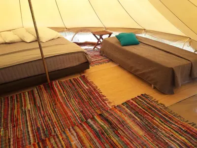 a bedroom with two beds and a tent at Village Del Mar in Solaro