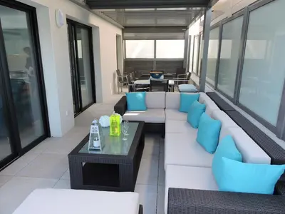 a living room with a couch and a table at Plage Propriano 4 étoiles in Propriano