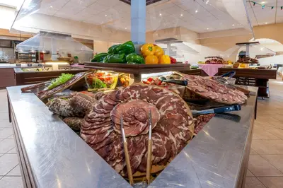 a buffet line with many different types of food at Hotel Club Marina Viva in Porticcio
