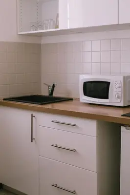 a kitchen counter with a microwave and a sink at Creste E Mare in Ajaccio