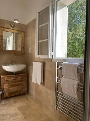 a bathroom with a sink and a window at Domaine de Bracciole in Corte
