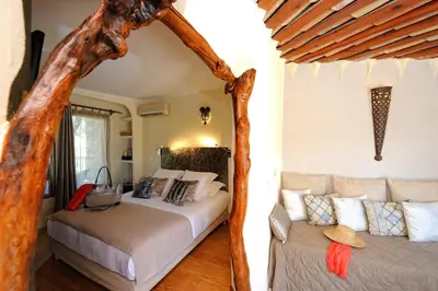 a bedroom with two beds in a room at Lodge de Charme A Cheda in Bonifacio
