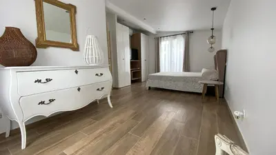 a living room with a dresser and a bedroom at Villa Altea- Lido Marana - piscine privée exclusive - plage à pied - 3 bedrooms house - private swimming pool - beach access on foot in Bastia