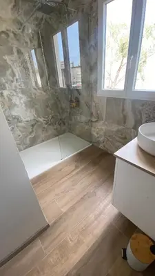 a bathroom with a shower and a sink and a toilet at Villa Altea- Lido Marana - piscine privée exclusive - plage à pied - 3 bedrooms house - private swimming pool - beach access on foot in Bastia
