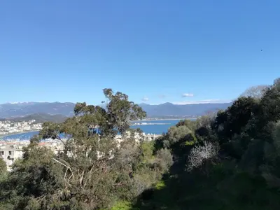 a view of a body of water from a hill at Appartement Lumineux Vue Panoramique in Ajaccio
