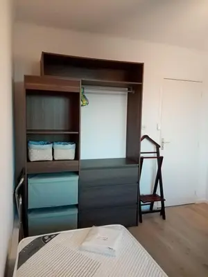 a bedroom with a bunk bed and a closet at Appartement Lumineux Vue Panoramique in Ajaccio