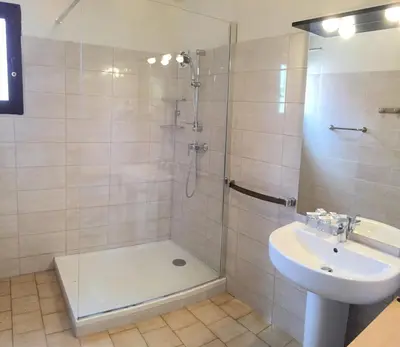 a bathroom with a shower and a sink at Hotel et Résidence Cala di sole in Porto Ota