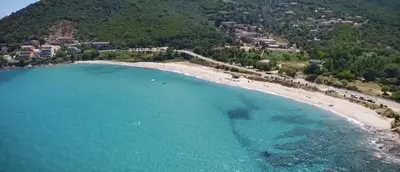 an aerial view of a beach with a resort at Résidence Stella di Mare in Sainte-Lucie de Porto-Vecchio