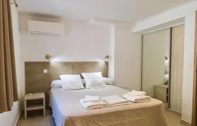 a bedroom with a bed with towels on it at Résidence Stella di Mare in Sainte-Lucie de Porto-Vecchio