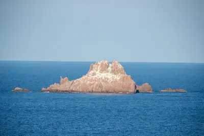 a small island in the middle of the ocean at Residence Monte Cristo in Sainte-Lucie de Porto-Vecchio
